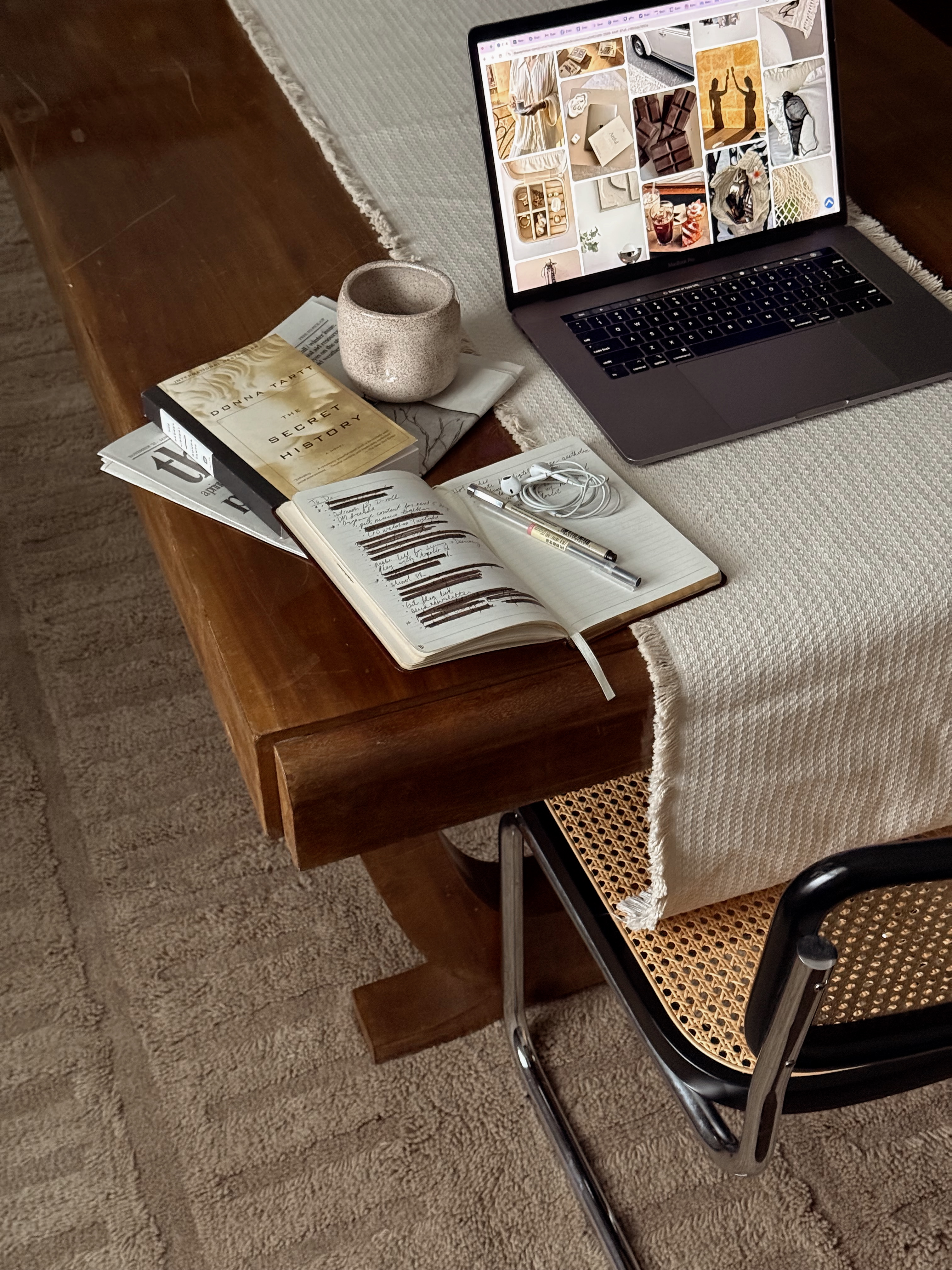 Creator workspace with laptop and notebook